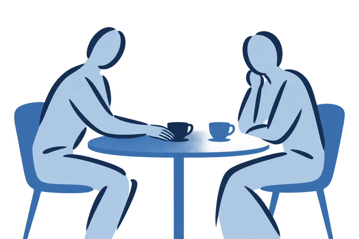Two people at a round table with two cups, one cup pushed across.